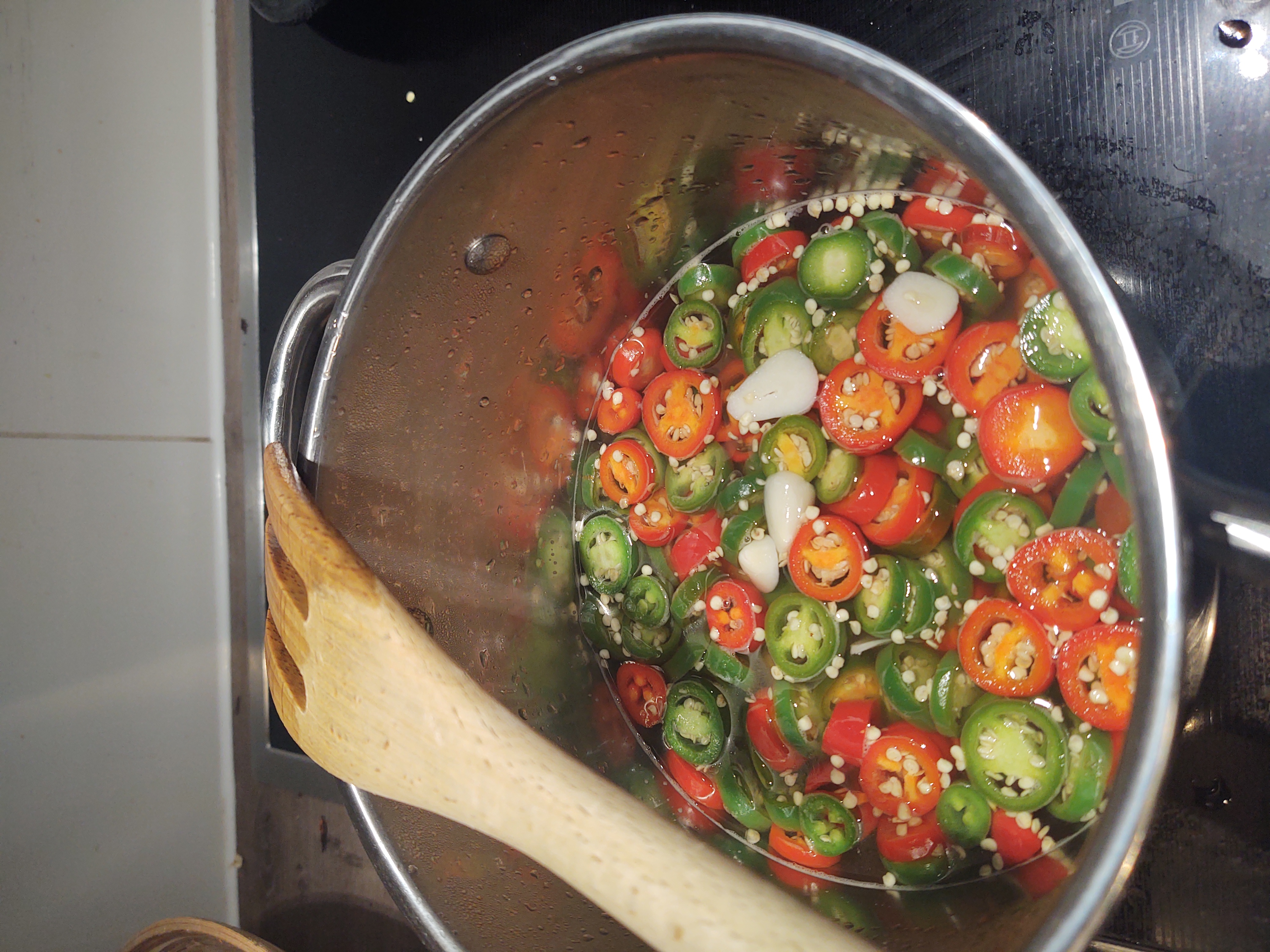 Jalapeños and garlic in a pot