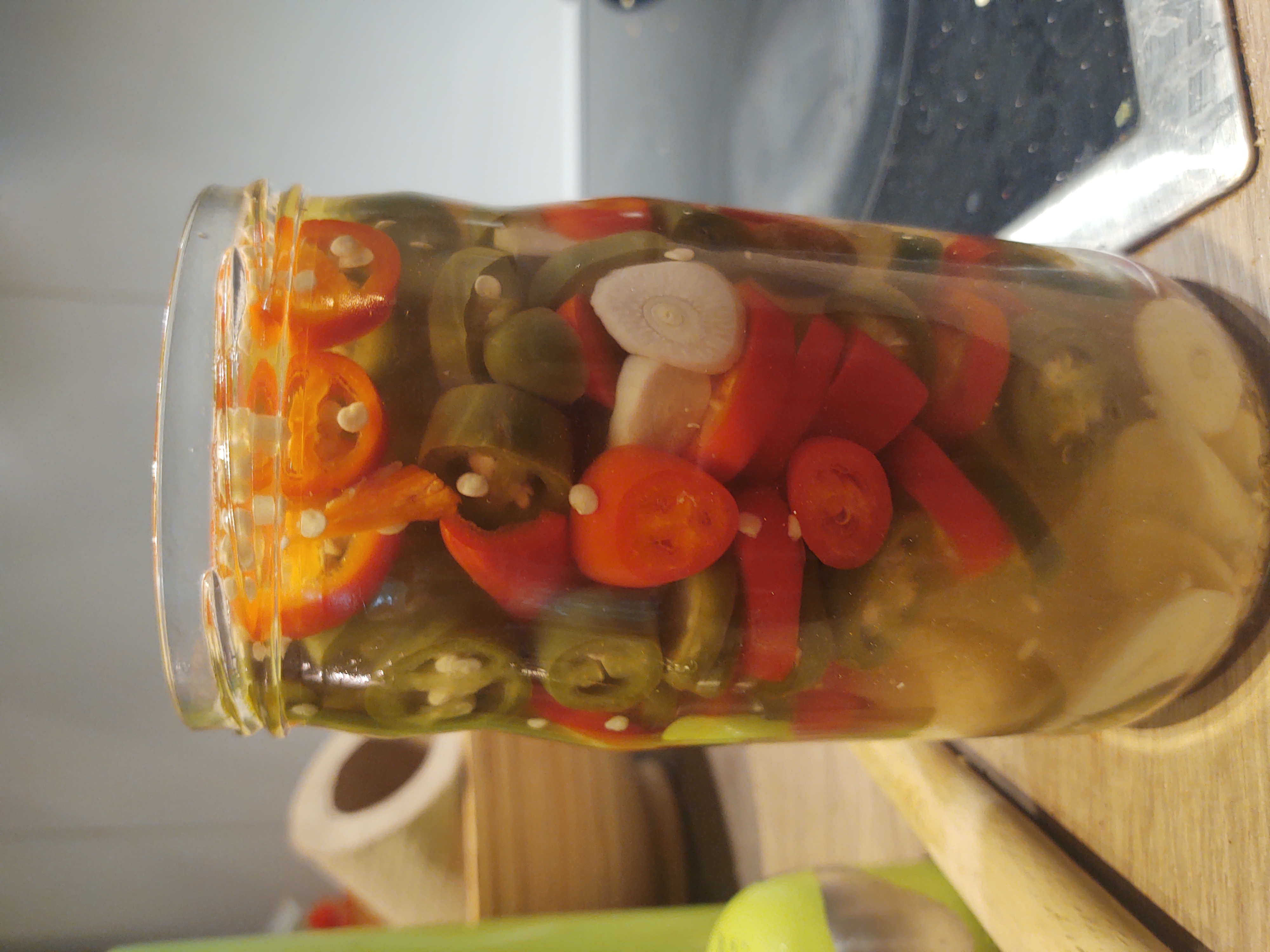 Jalapeños and garlic in a container